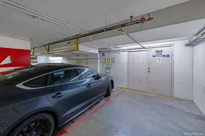 a car parked in a garage with a fire hydrant at Beautiful Downtown Studio with Parking in Vancouver