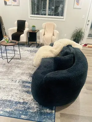 a living room with a bean bag chair and chairs at Spacious Private Room with TV, WiFi and Fridge in Edmonton