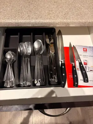 a tray filled with utensils on a counter at Royal Bay Guest Suite in Victoria
