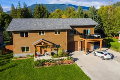 an aerial view of a house with a car parked in the driveway at Big Bear Chalet and spa in Revelstoke