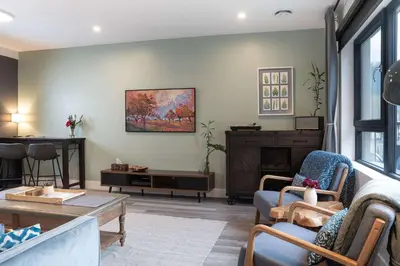 a living room with a couch and a table at Tu Casa - 2 Bedroom Condo with Private Hot tub in Revelstoke