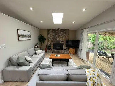 a living room with a couch and a table at The Forest Pedal House in Squamish