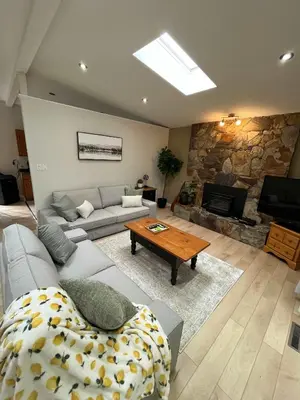 a living room with a couch and a table at The Forest Pedal House in Squamish