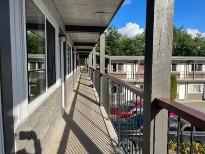 a balcony of a building with a view of a parking lot at Chalet Inn in Kitimat