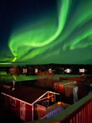 an image of the northern lights in the sky at Aurora Bayside Inn in Yellowknife