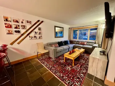 a living room with a couch and a table at Panorama Mountain Resort - Horsethief Lodge with Fairmont Creek in Panorama