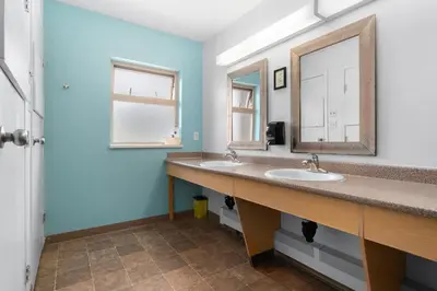 a bathroom with two sinks and a mirror at Squamish Adventure Inn in Squamish
