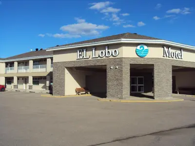 a hotel with a sign on the front of it at El Lobo Motel in Cold Lake