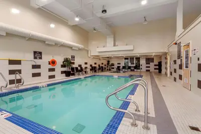 a large swimming pool in a hotel room at Best Western PLUS Fort Saskatchewan Inn & Suites in Fort Saskatchewan