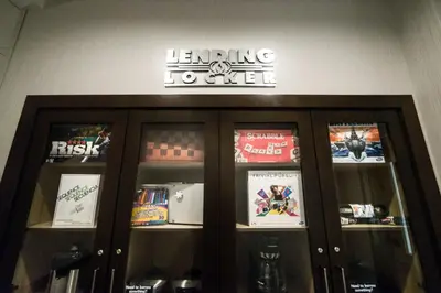 a store with a sign on the wall and some shelves at Candlewood Suites West Edmonton - Mall Area by IHG in Edmonton