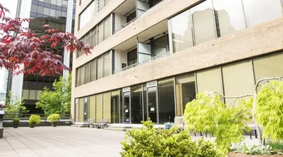 a building with a courtyard in front of it at Howe Street Apartment with Views in Vancouver