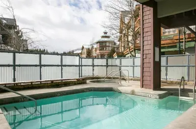 a swimming pool on top of a building at Tyndalstone Lodge 3 Bedroom in the Heart of Village North Whistler in Whistler