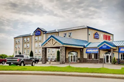 a hotel with a truck parked in front of it at Lakeview Inns & Suites - Fort Saskatchewan in Fort Saskatchewan