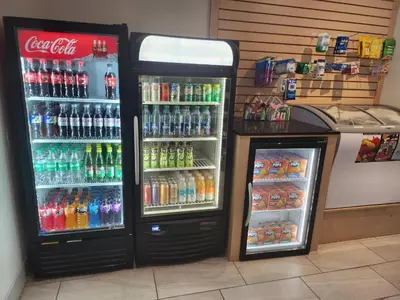 two soda machines in a store with drinks at Holiday Inn Express & Suites Terrace by IHG in Terrace