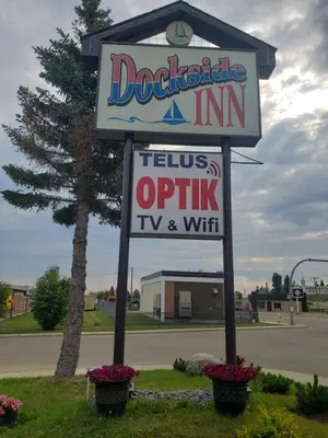 a sign for a dog whistle inn in a dealership at Dockside Inn in Cold Lake