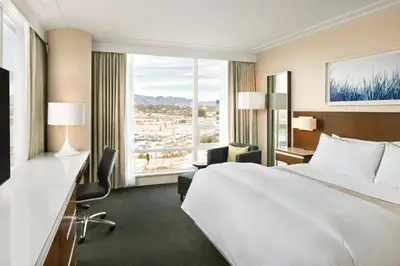 a hotel room with a bed and a large window at The Westin Wall Centre, Vancouver Airport in Richmond