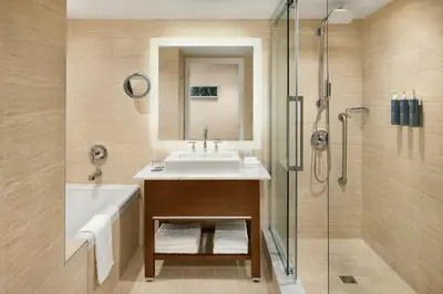 a bathroom with a sink and a shower at The Westin Wall Centre, Vancouver Airport in Richmond