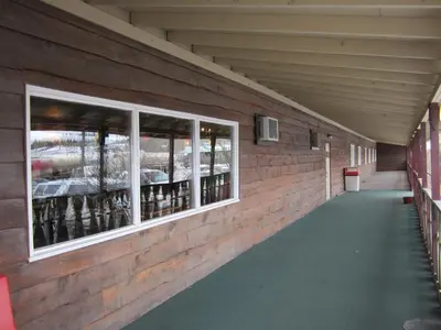 a long hallway with windows in a building at Airport Chalet in Whitehorse