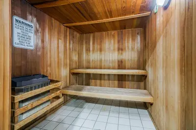 a sauna with a bench in a wooden wall at Best Western Peace Arch Inn in Surrey
