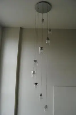 a bunch of chandeliers hanging from a ceiling at Economy Inn in Edmonton