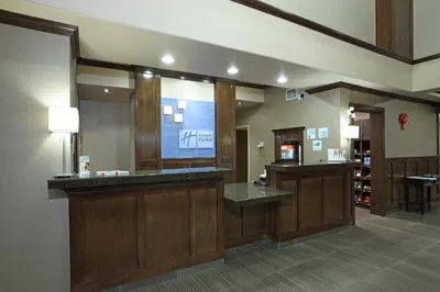 a waiting room with a tv in a hospital at Holiday Inn Express Hotel & Suites Vernon by IHG in Vernon