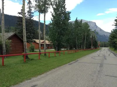 a red fence on the side of a road at Jasper Gates Resort in Jasper