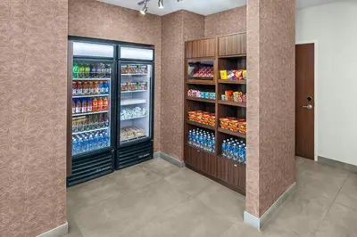 a store room with two refrigerators with drinks at Fairfield Inn & Suites by Marriott Edmonton North in Edmonton