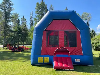 a blue and red play tent in a field at Blaeberry Valley Vacation Rentals in Golden