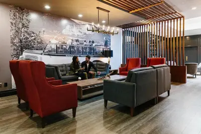 two people sitting in a waiting room at Elk + Avenue Hotel in Banff