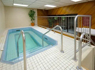 a swimming pool in a building with at Elk + Avenue Hotel in Banff