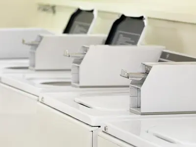 a row of white printers sitting on a table at Royal Scot Hotel & Suites in Victoria