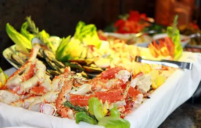 a white plate of food on a table at Sawridge Inn and Conference Centre Edmonton South in Edmonton