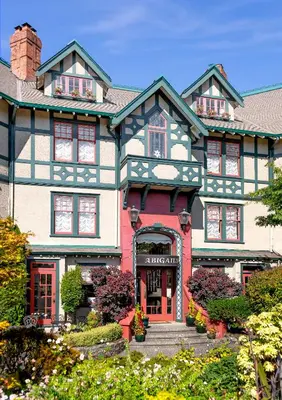 a large house with a red front door at Abigail's Hotel in Victoria