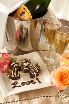a plate of chocolate desserts on a table with wine glasses at Abigail's Hotel in Victoria