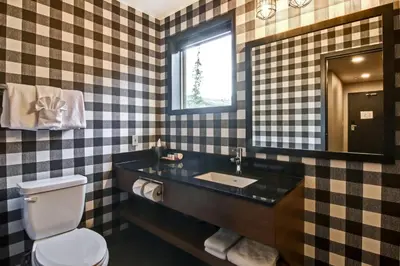 a bathroom with a sink and a toilet at Canalta Lodge in Banff