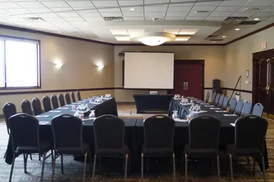 a conference room with a long table and chairs at Radisson Hotel & Conference Centre Edmonton in Edmonton