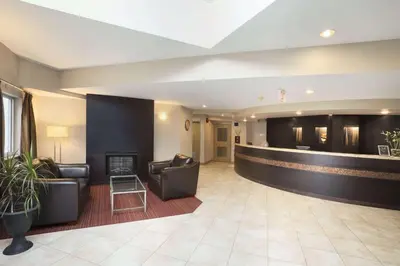 a lobby with couches and a fireplace in a hotel at Super 8 by Wyndham West Kelowna BC in West Kelowna