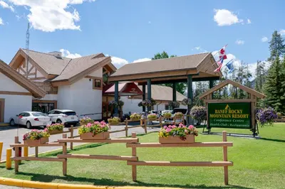 a group of benches in front of a building at Banff Rocky Mountain Resort in Banff