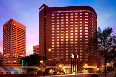 a tall building with lights on in a city at The Westin Edmonton in Edmonton