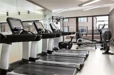 a gym with treadmills and elliptical machines at The Westin Edmonton in Edmonton