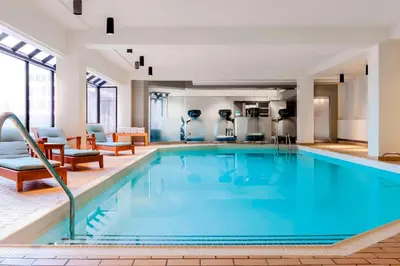 a large pool with blue water in a hotel room at The Westin Edmonton in Edmonton