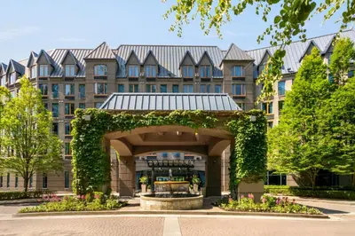 a large building with a fountain in front of it at Holiday Inn & Suites North Vancouver by IHG in North Vancouver