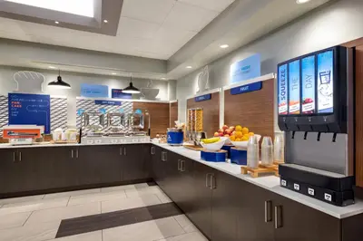 a large kitchen with a large tv in the middle at Holiday Inn Express Vancouver-Metrotown (Burnaby) in Burnaby