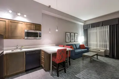 a kitchen and living room in a hotel room at Holiday Inn Express & Suites Riverport Richmond by IHG in Richmond