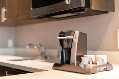 a coffee maker sitting on a counter in a kitchen at Holiday Inn Express & Suites Riverport Richmond by IHG in Richmond
