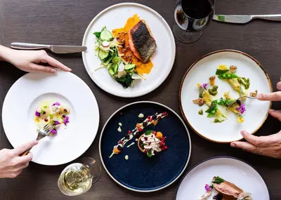 a table with plates of food on it at The Magnolia Hotel & Spa in Victoria
