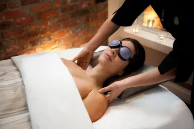 a woman getting her hair cut by a beautician at The Magnolia Hotel & Spa in Victoria