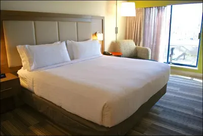 a large white bed in a hotel room with a window at Holiday Inn Express Vancouver Airport-Richmond by IHG in Richmond