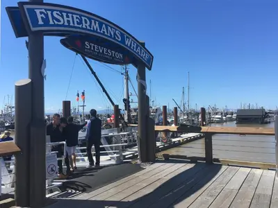 a group of people standing on a dock at Holiday Inn Vancouver Airport Richmond by IHG in Richmond