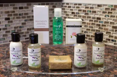 a group of four bottles of hair products on a counter at Chateau Lacombe Hotel in Edmonton